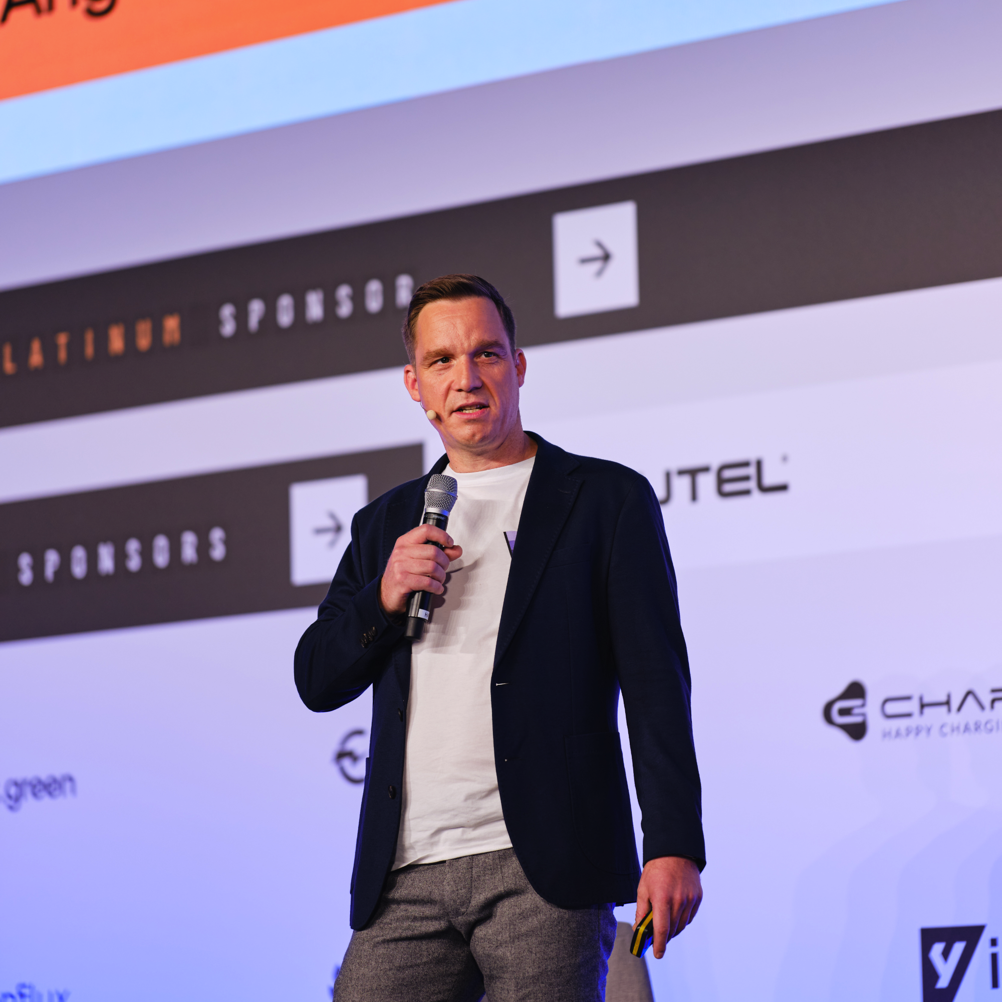 Speaker at conference discussing EV-Charging and the future of mobility.