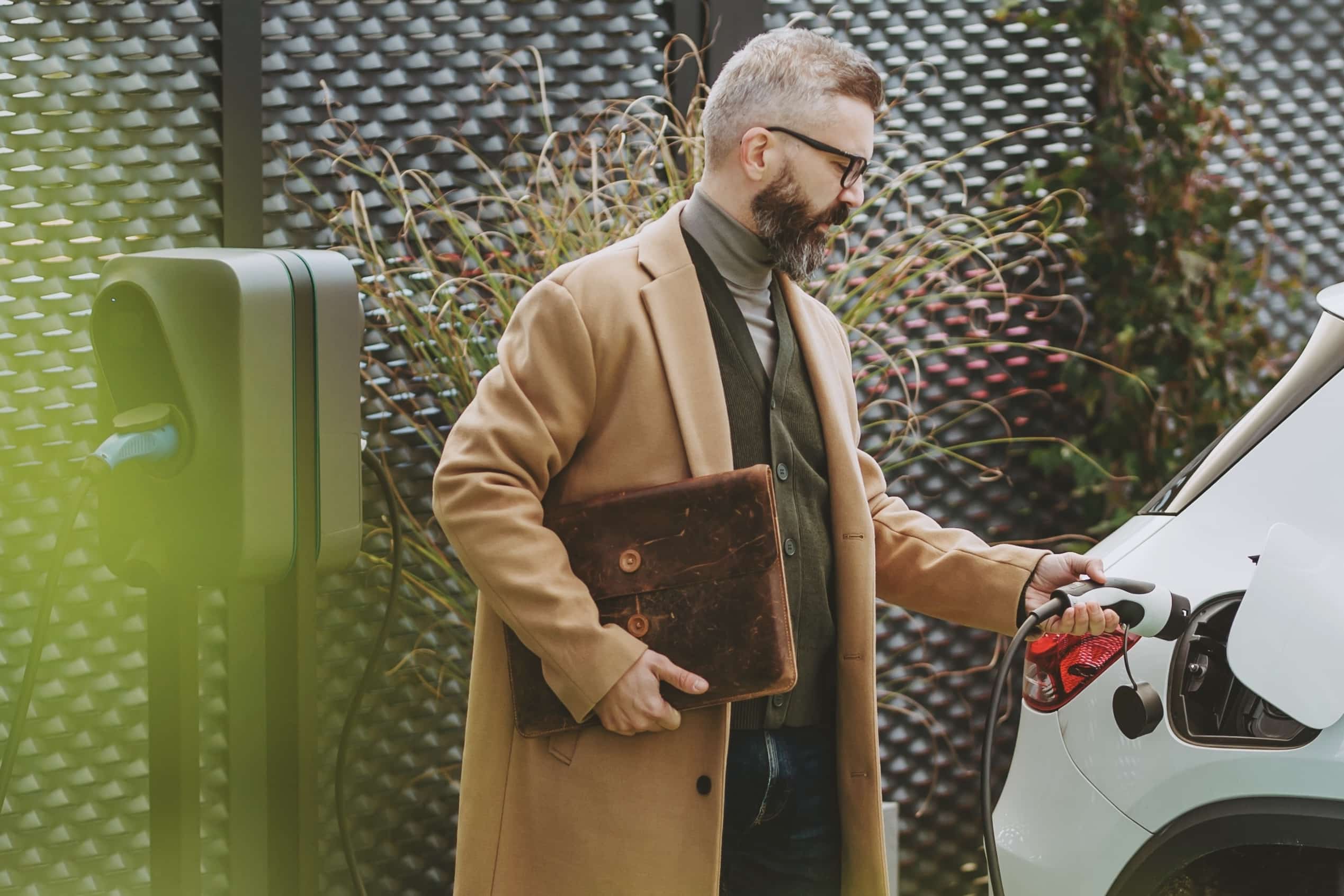 Man using EV-Charging station, showcasing eMobility and the future of mobility solutions.