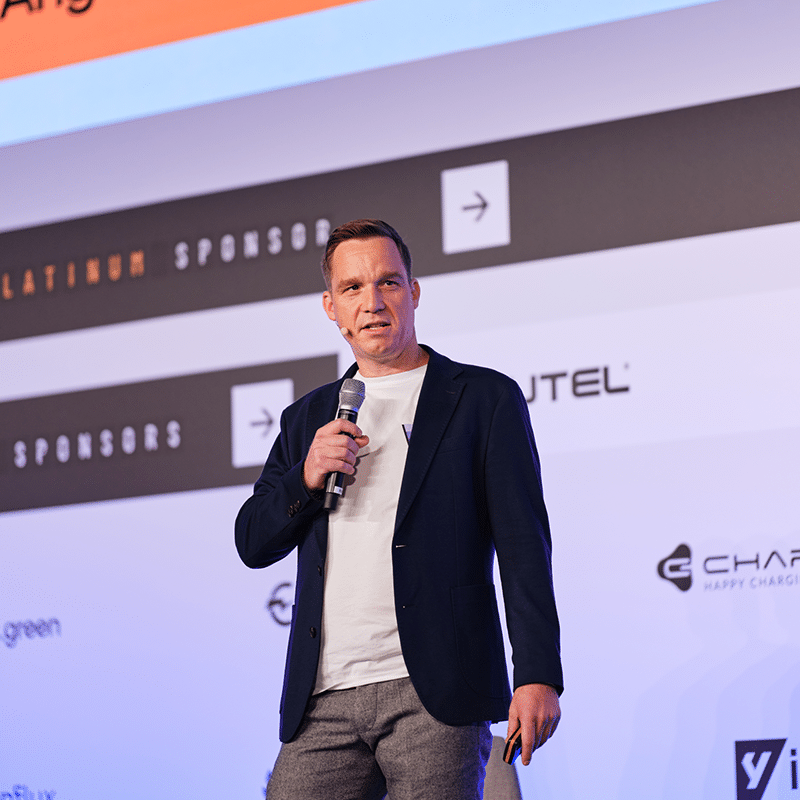 Speaker discussing eMobility innovations at a conference on the future of mobility.