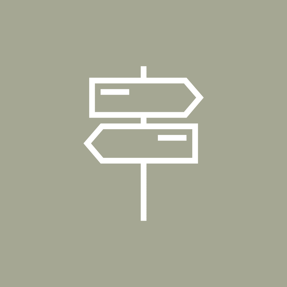 Direction sign with arrows on beige background, symbolizing choices in the future of mobility and eMobility.